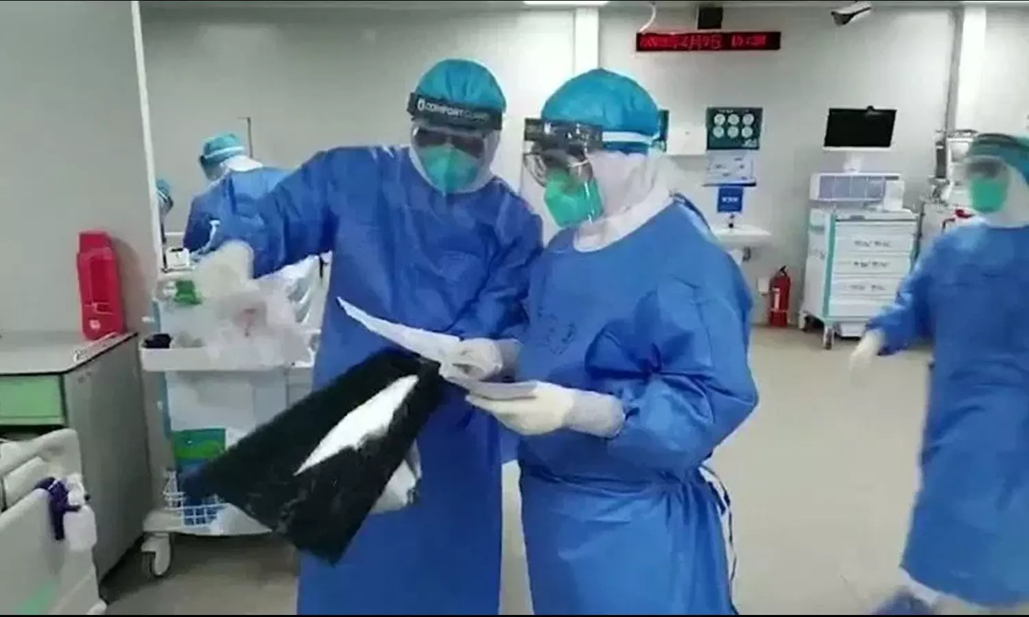 Indian doctors fight coronavirus with raincoats, helmets amid lack of equipment