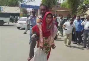 Mathura: Woman carries differently-abled husband on shoulders to obtain disability certificate